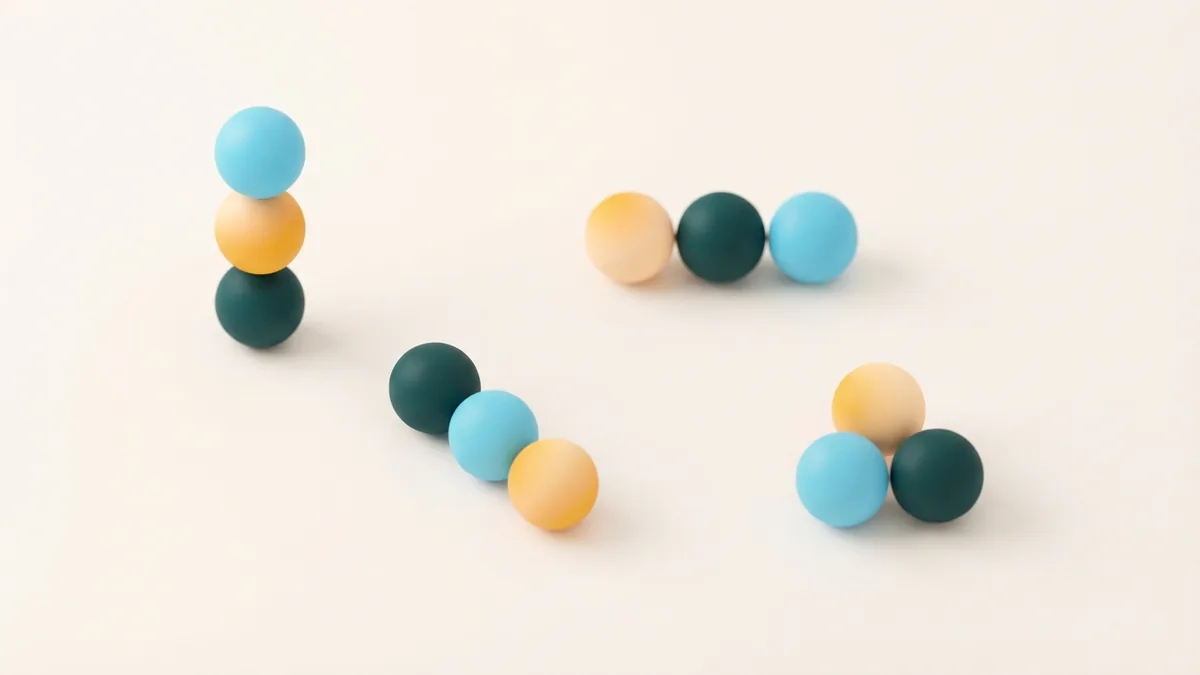Zodiac signs shown as grouped forms Twelve abstract spheres arranged in clusters to represent zodiac sign groups
