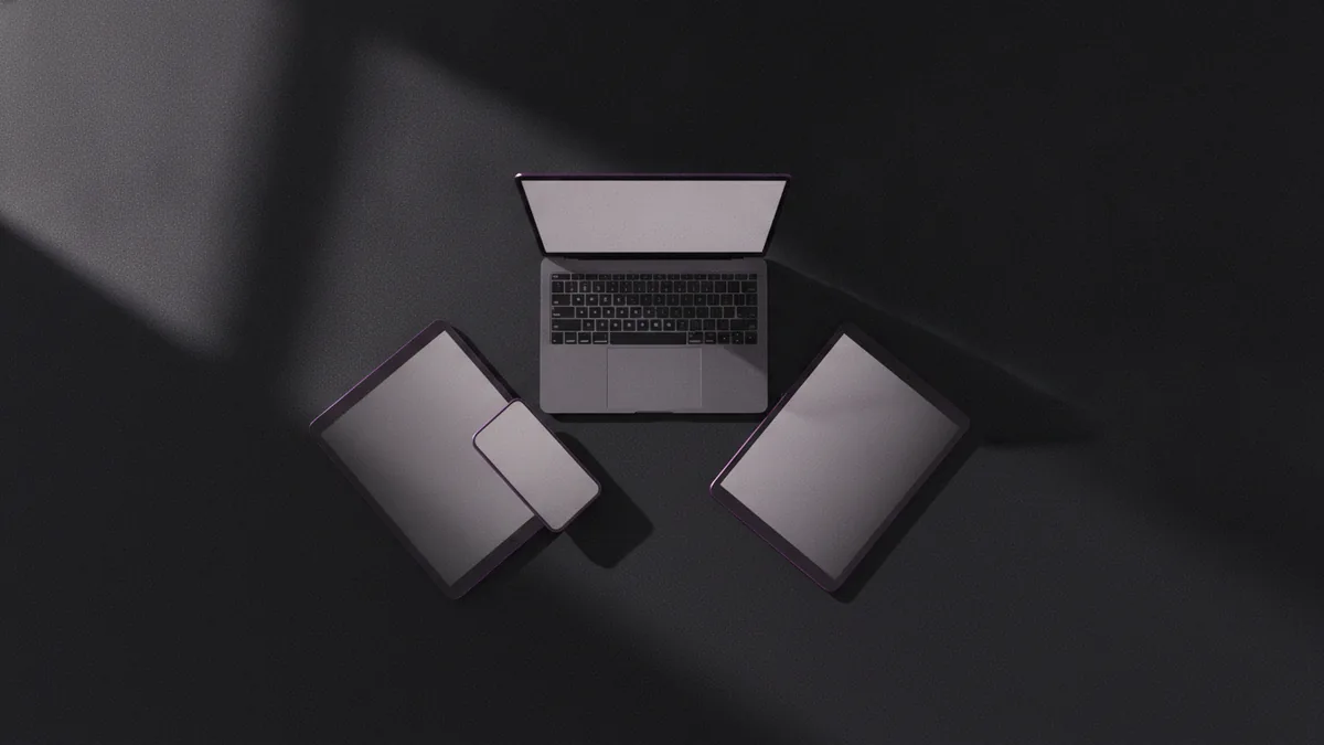 Laptop, tablet, and phone lined up to copy and paste symbols