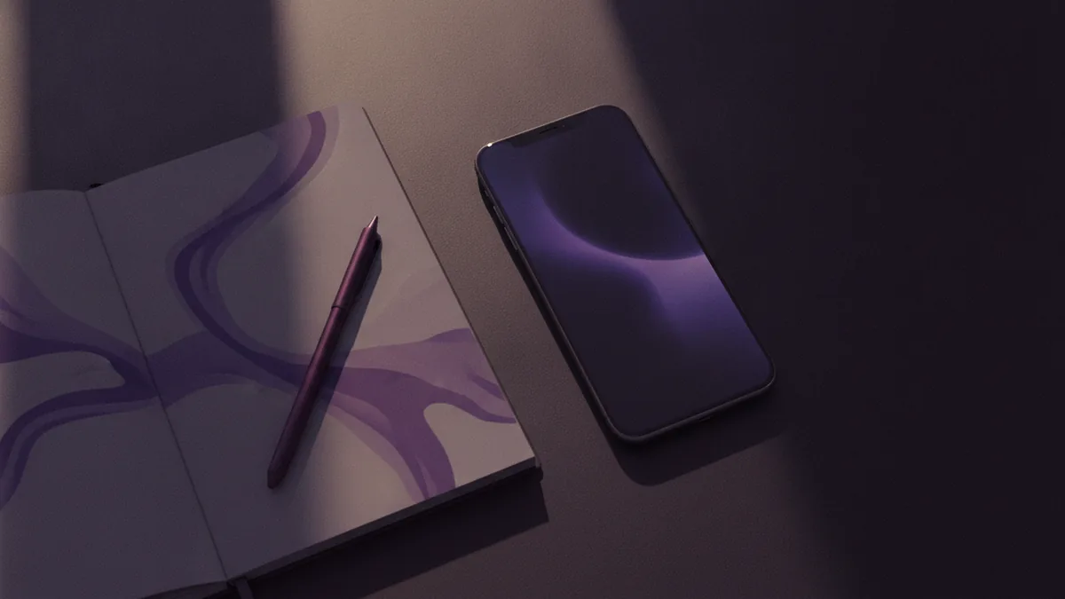 Drafting your bio Notebook and phone setup for drafting an Instagram bio