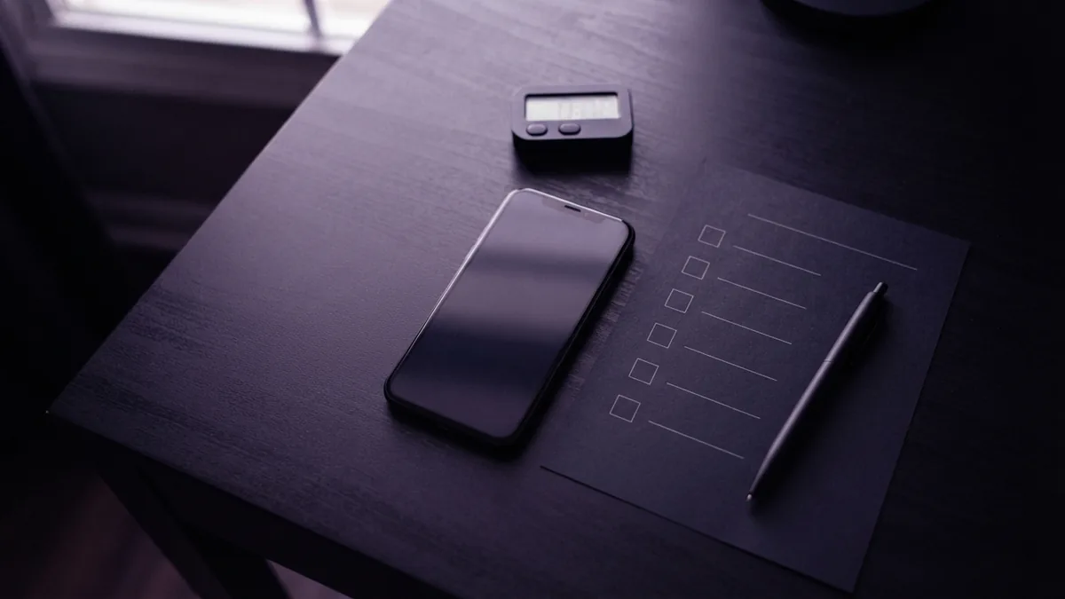 Testing a profile link before sharing Mobile link testing setup with a phone, checklist, and clean desk tools